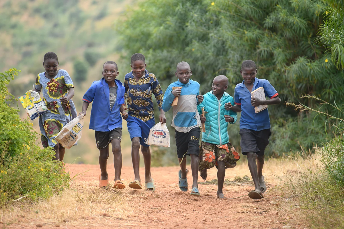 Children walking together on a road in Ntchisi, Malawi