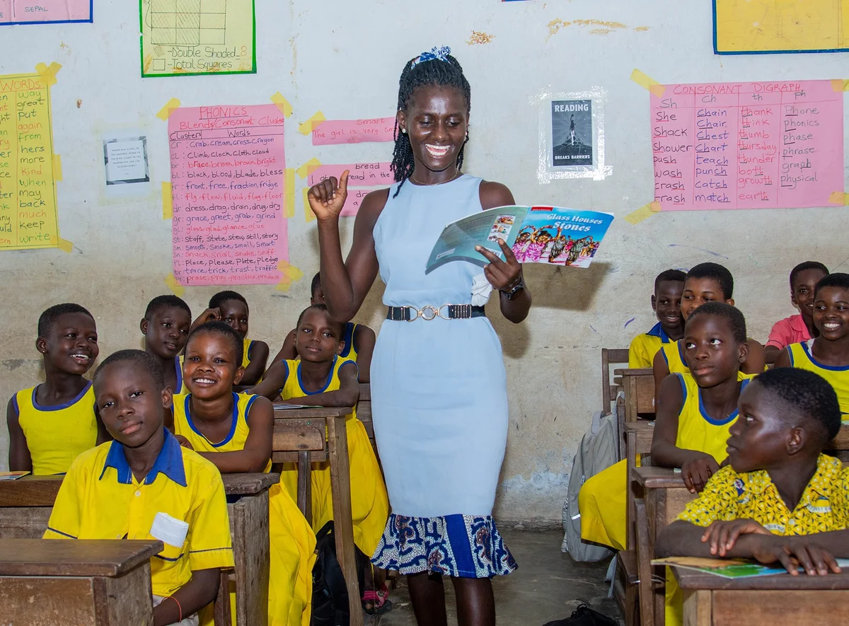 Teacher and students in a Reading Ghana classroom in Ghana's Western Region