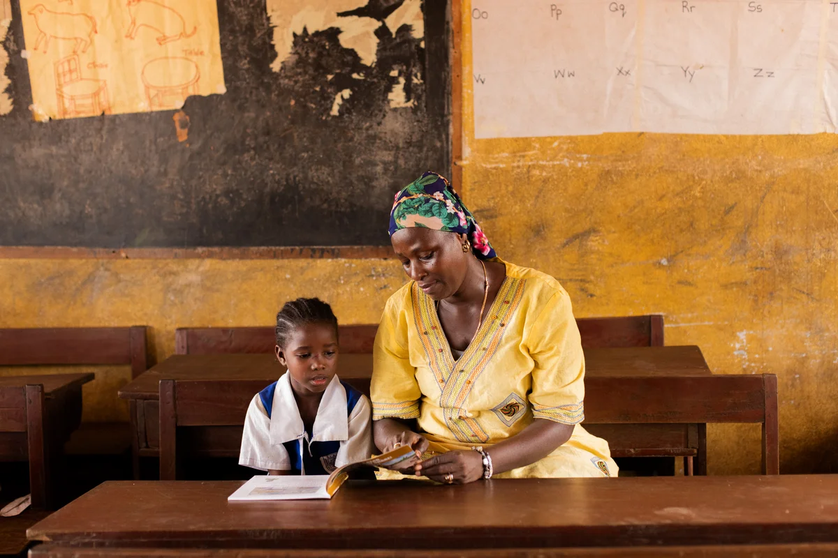 Mentor working one-on-one with a young student