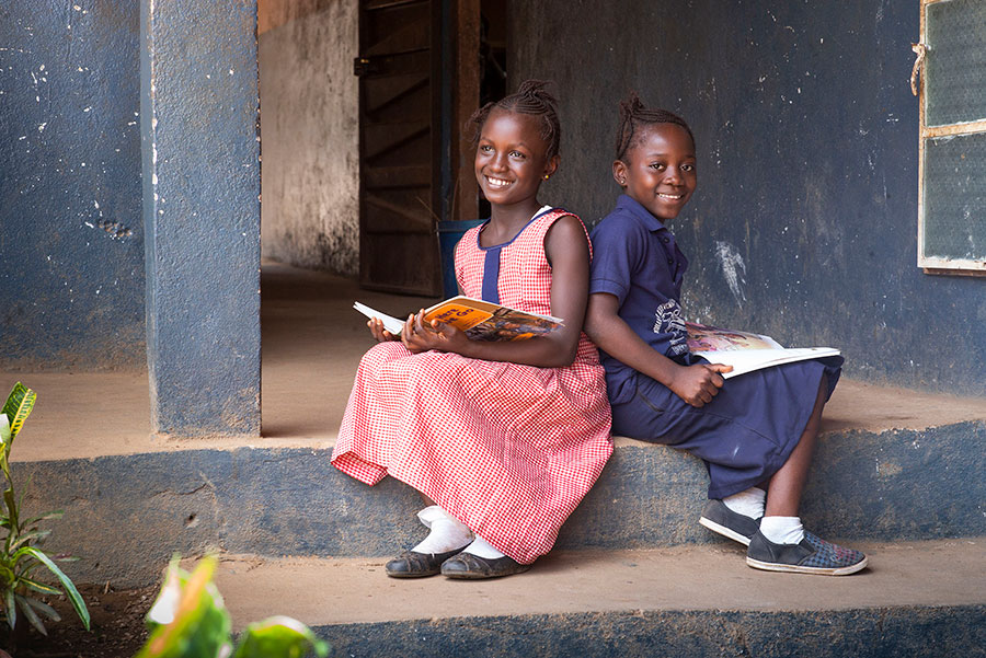 2 girls on a step in Sierra Leone