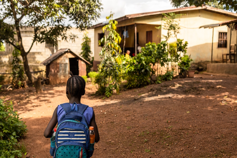 Even still, she walks nearly an hour each day – through rough terrain and facing the threat of violence – to reach her school.