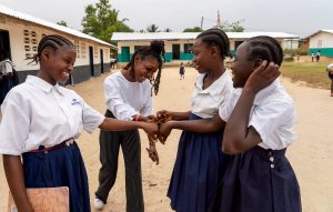 Denise, The Mobile Learning Lab Coordinator For The Girls’ Accelerated Learning Initiative In Liberia, Is Greeted Like A Rock Star By The Program’s Participants During Her School Visits. The Program Harnesses Digital Learning Opportunities To Facilitate Both Academic And Life Skills Development.